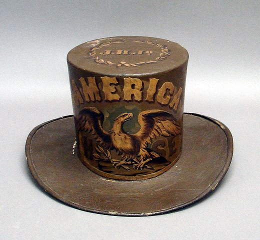 Appraisal: Parade fire hat top hat form for the America Hose