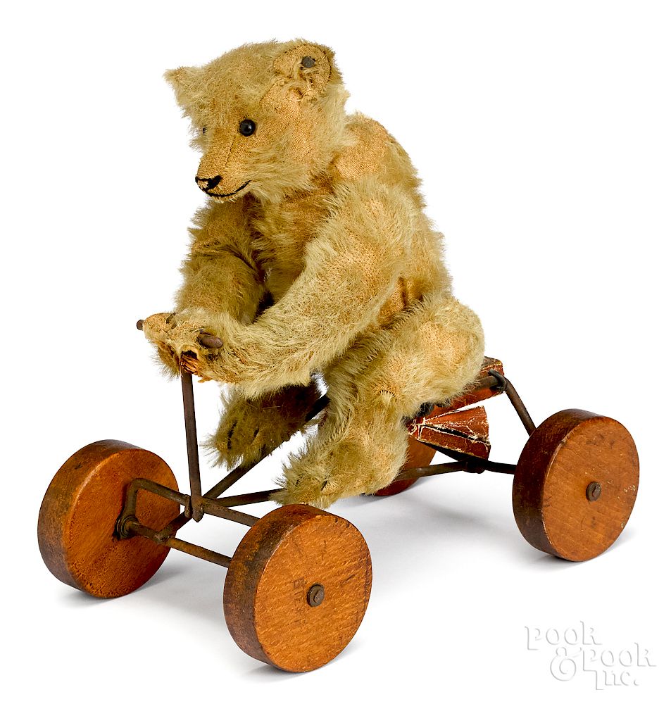 Appraisal: Steiff mohair teddy bear on Irish mail pull toy Steiff