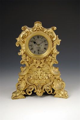 Appraisal: A mid th century gilt brass mantel timepiece with a