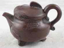 Appraisal: A Chinese Yixing teapot with impressed mark to base and