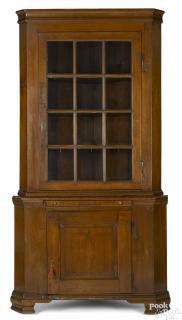 Appraisal: Pennsylvania walnut two-part corner cupboard late th c retaining its