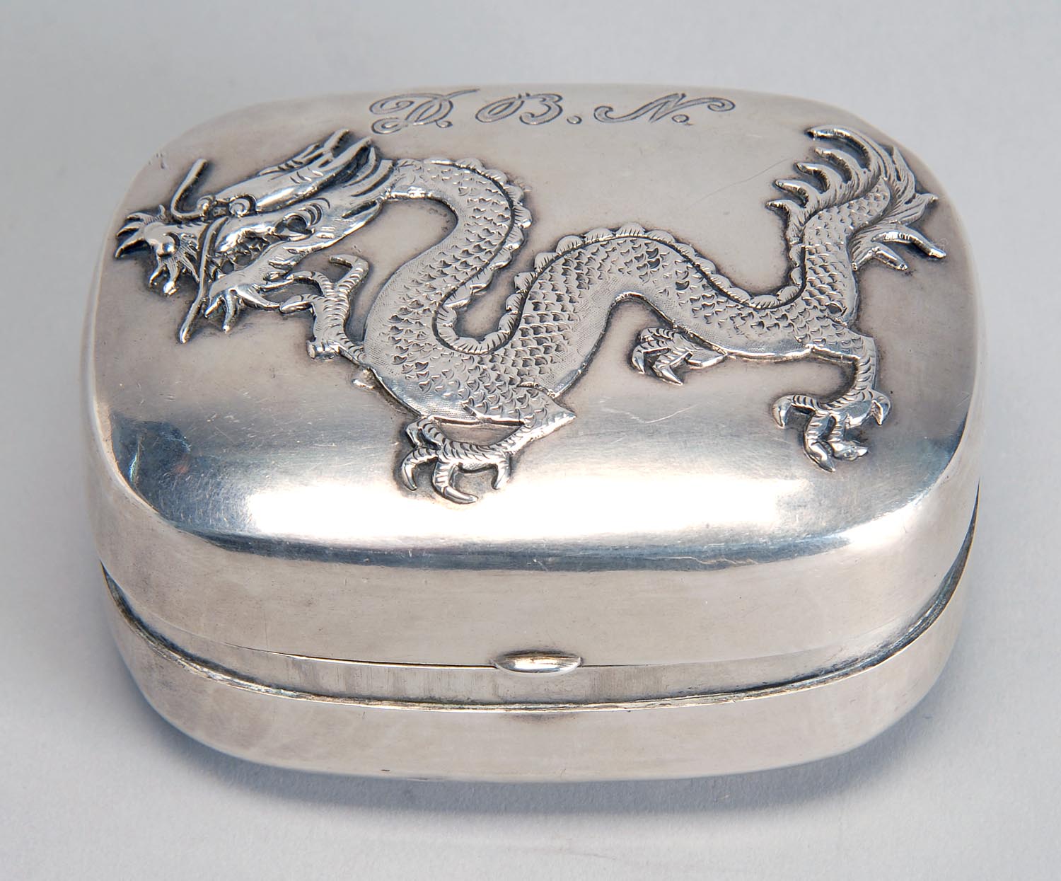 Appraisal: CHINESE EXPORT SILVER BOX With applied dragons on front and