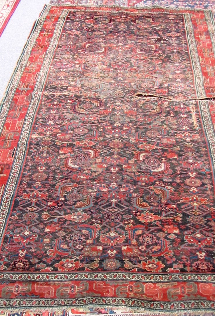 Appraisal: A North East Persian Kelleh the brown field with an