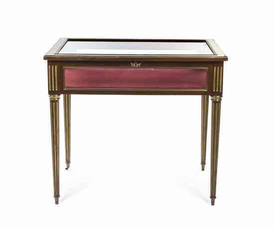 Appraisal: A Louis XVI Style Brass Inlaid Vitrine Table having a