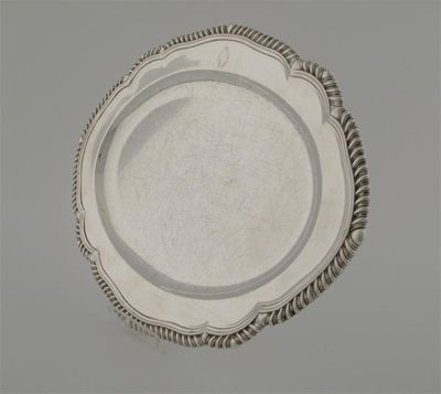 Appraisal: A Victorian oval meat plate with a gadrooned rim and