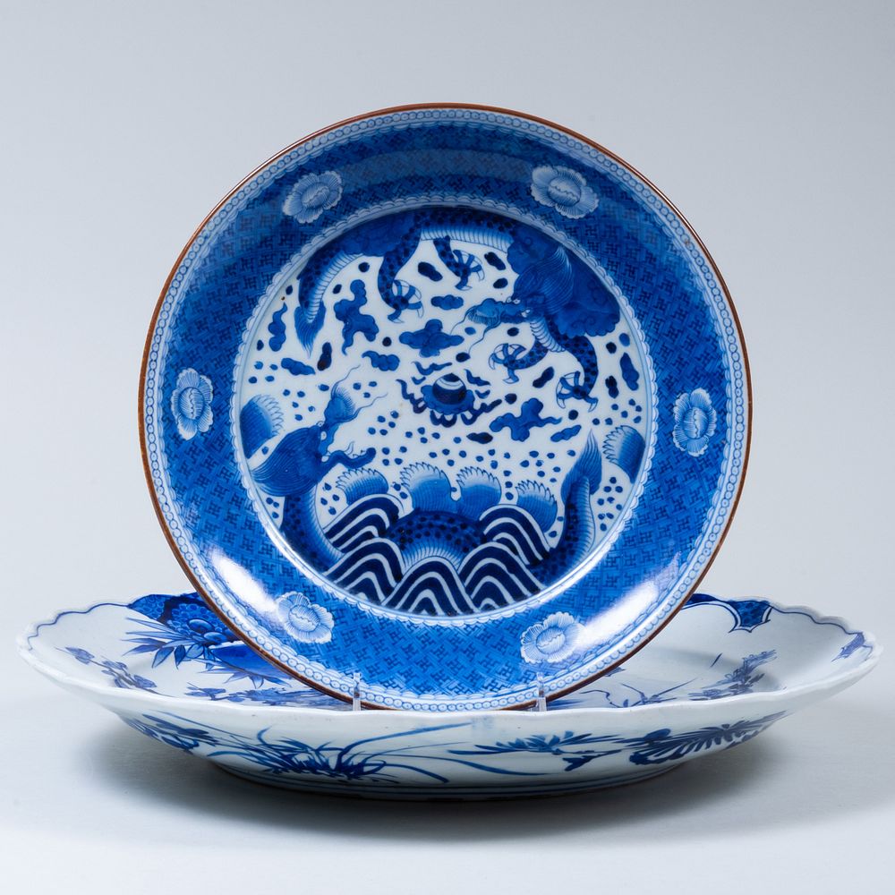 Appraisal: Two Asian Blue and White Porcelain Chargers The larger with