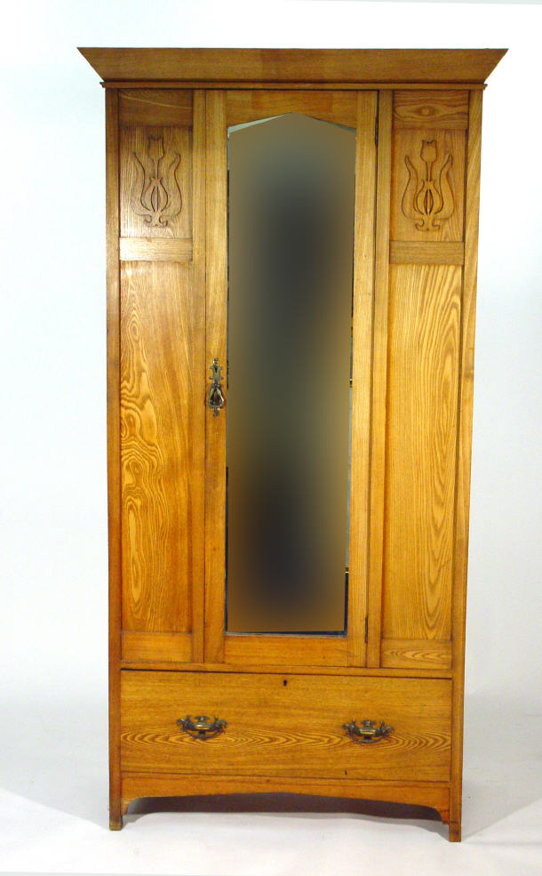 Appraisal: Art Nouveau oak wardrobe fitted a single mirrored door flanked