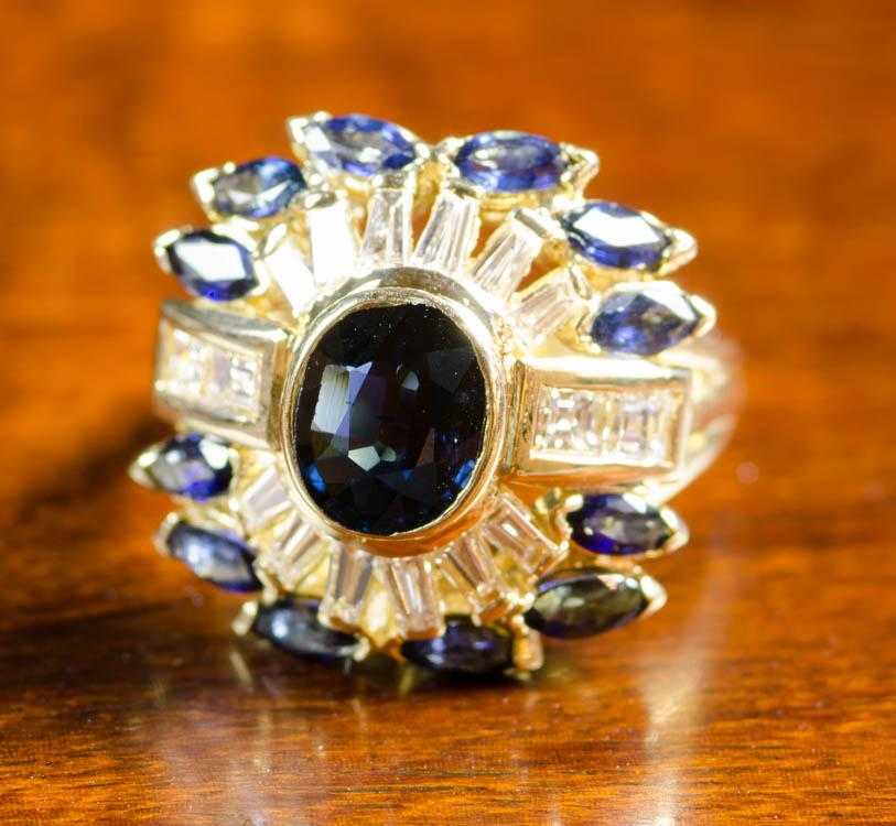 Appraisal: SAPPHIRE DIAMOND AND EIGHTEEN KARAT GOLD RING with twelve marquise-cut