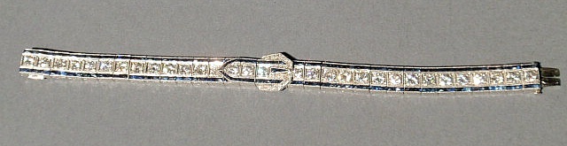 Appraisal: Platinum diamond and sapphire channel set bracelet with a center