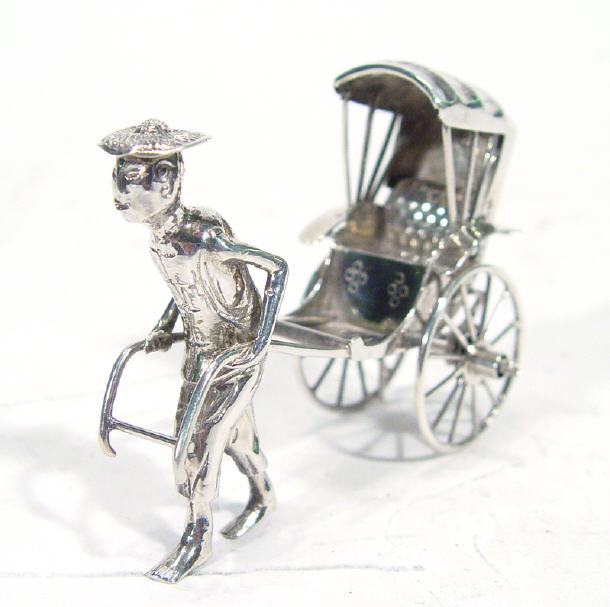 Appraisal: Miniature Chinese silver figure pulling a cart cm high