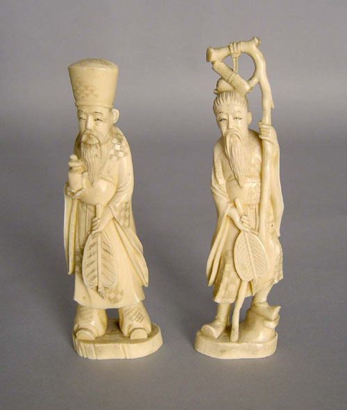 Appraisal: Two oriental carved ivory figures ca h and h