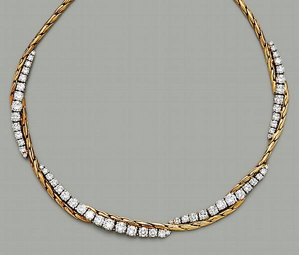 Appraisal: A diamond platinum and eighteen karat gold necklace estimated total