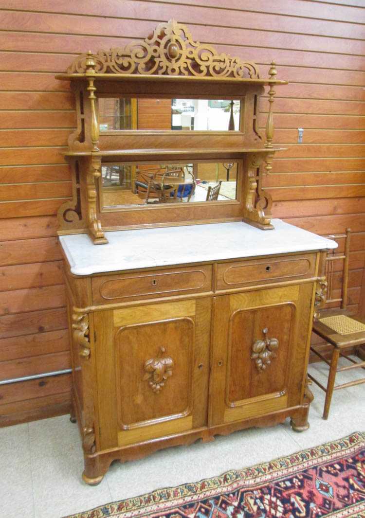 Appraisal: A VICTORIAN WALNUT SIDEBOARD American th century featuring an etagere