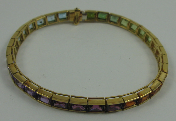 Appraisal: COLORED GEMSTONES AND FOURTEEN KARAT GOLD BRACELET in length and