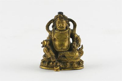 Appraisal: A small Tibeto-Chinese gilt bronze figure of Jambhala seated on