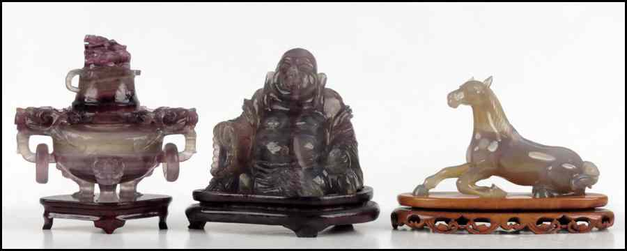 Appraisal: CARVED FLUORITE BUDDHA Raised on a '' base Together with