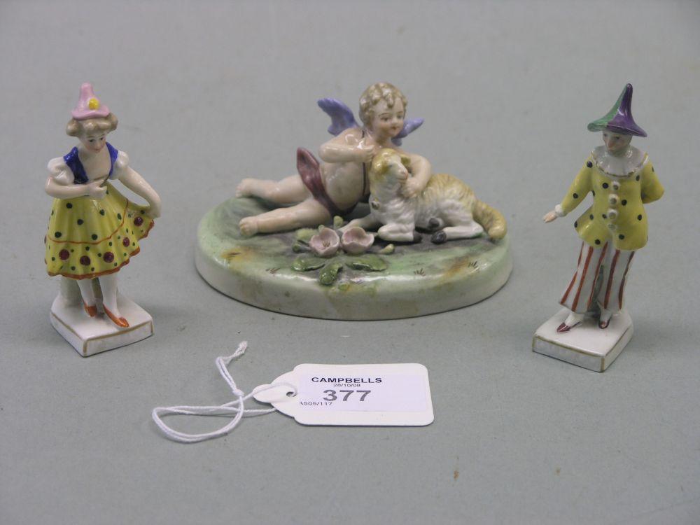 Appraisal: A Sitzendorf porcelain figure cherub lying beside a lamb in