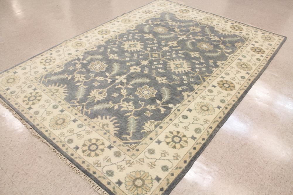 Appraisal: A CONTEMPORARY HAND KNOTTED ORIENTAL CARPET Indo-Persian overall cream floral