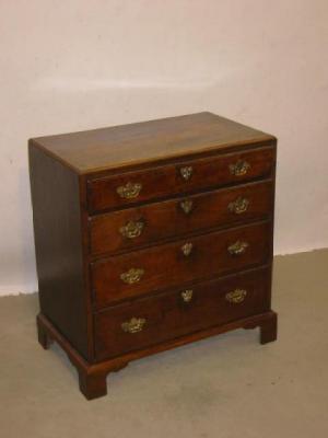 Appraisal: A MAHOGANY CHEST of four long graduated drawers with moulded