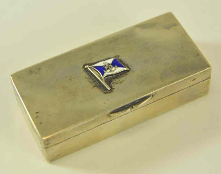 Appraisal: SILVER PLATED STAMP BOX For Hamburg Lines flag insignia emblem