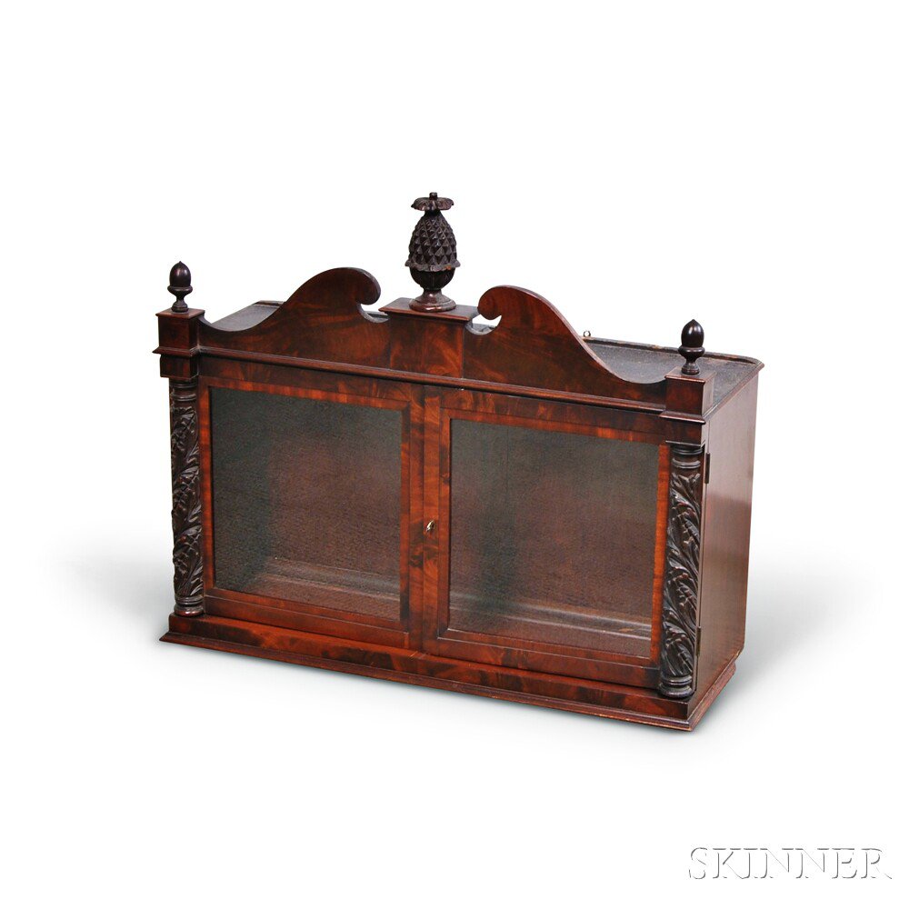 Appraisal: Federal-style Carved Mahogany Hanging Cabinet the broken-arch pediment with acorn