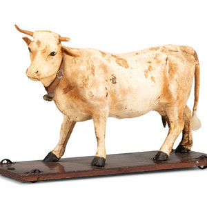 Appraisal: A Wood and Leather Mooing Cow-Form Pull Toy Circa with