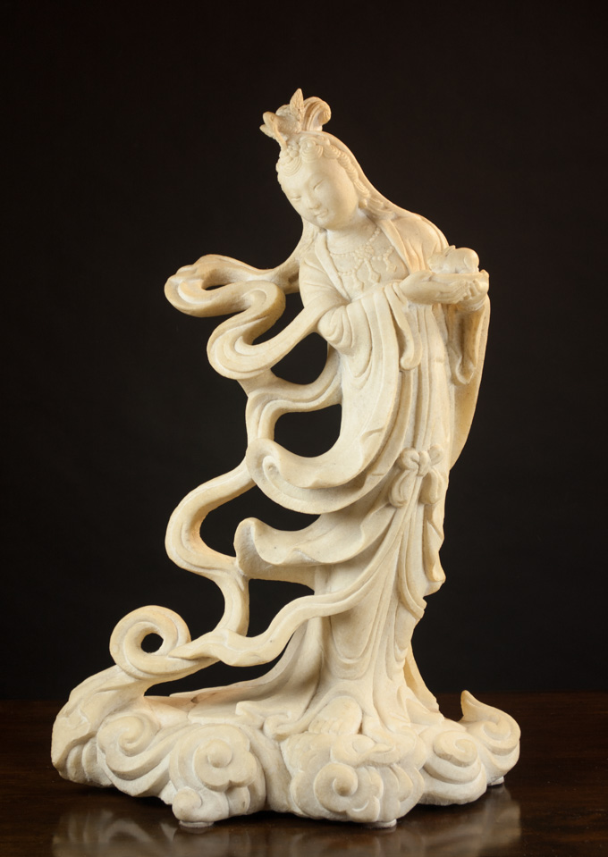 Appraisal: CHINESE FIGURAL MARBLE SCULPTURE the standing figure of Guanyin the