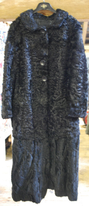 Appraisal: Lady's black astrakan fur coat with added piece to lengthen