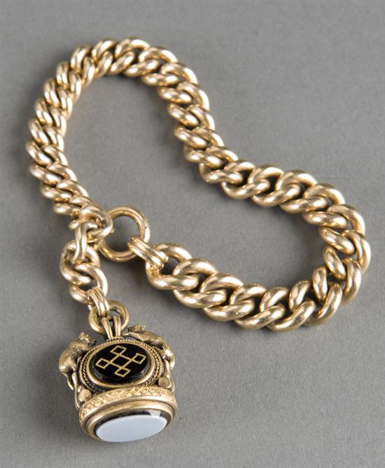 Appraisal: Kt gold watch chain and fob with wolf and bear