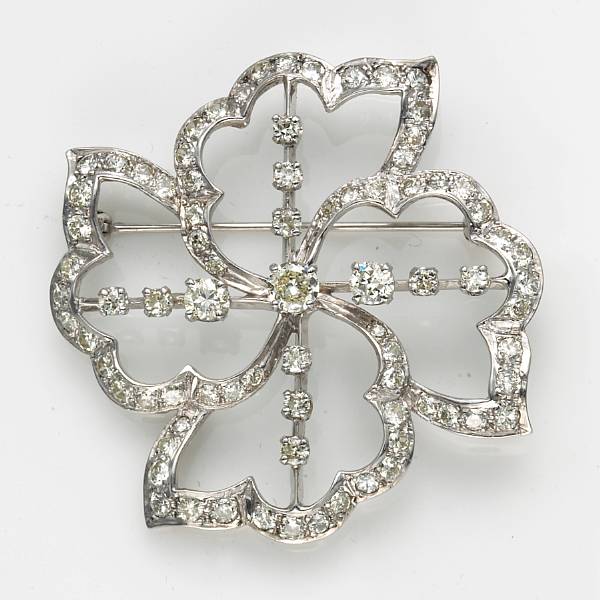 Appraisal: A diamond and fourteen karat white gold brooch estimated total