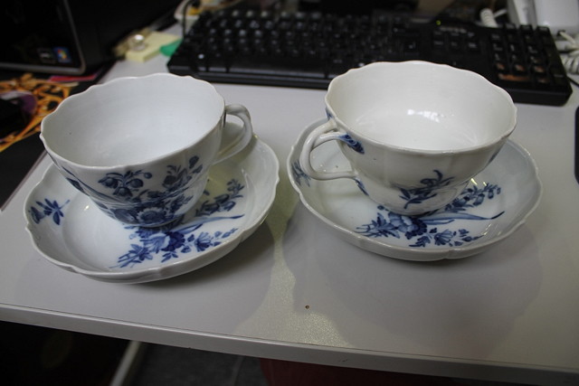 Appraisal: A PAIR OF MEISSEN BLUE AND WHITE CUPS and saucers