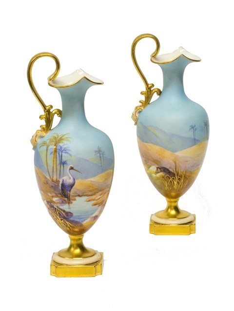 Appraisal: A pair of Royal Worcester ewers by Albert Shuck circa