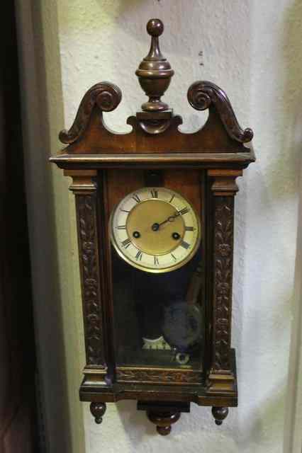 Appraisal: AN EDWARDIAN WALNUT WALL CLOCK with enamel dial swan neck