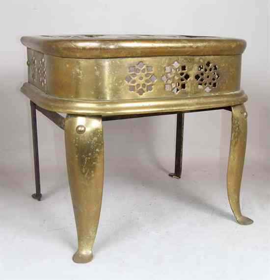 Appraisal: An English Victorian Brass Fireplace Footman circa having a pierced