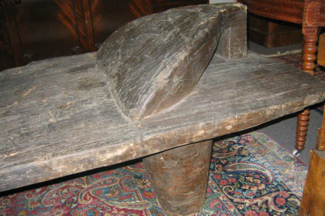 Appraisal: MASSIVE PRIMITIVE WOODEN CIRCUMCISION TABLE Of elongated rectangular form one