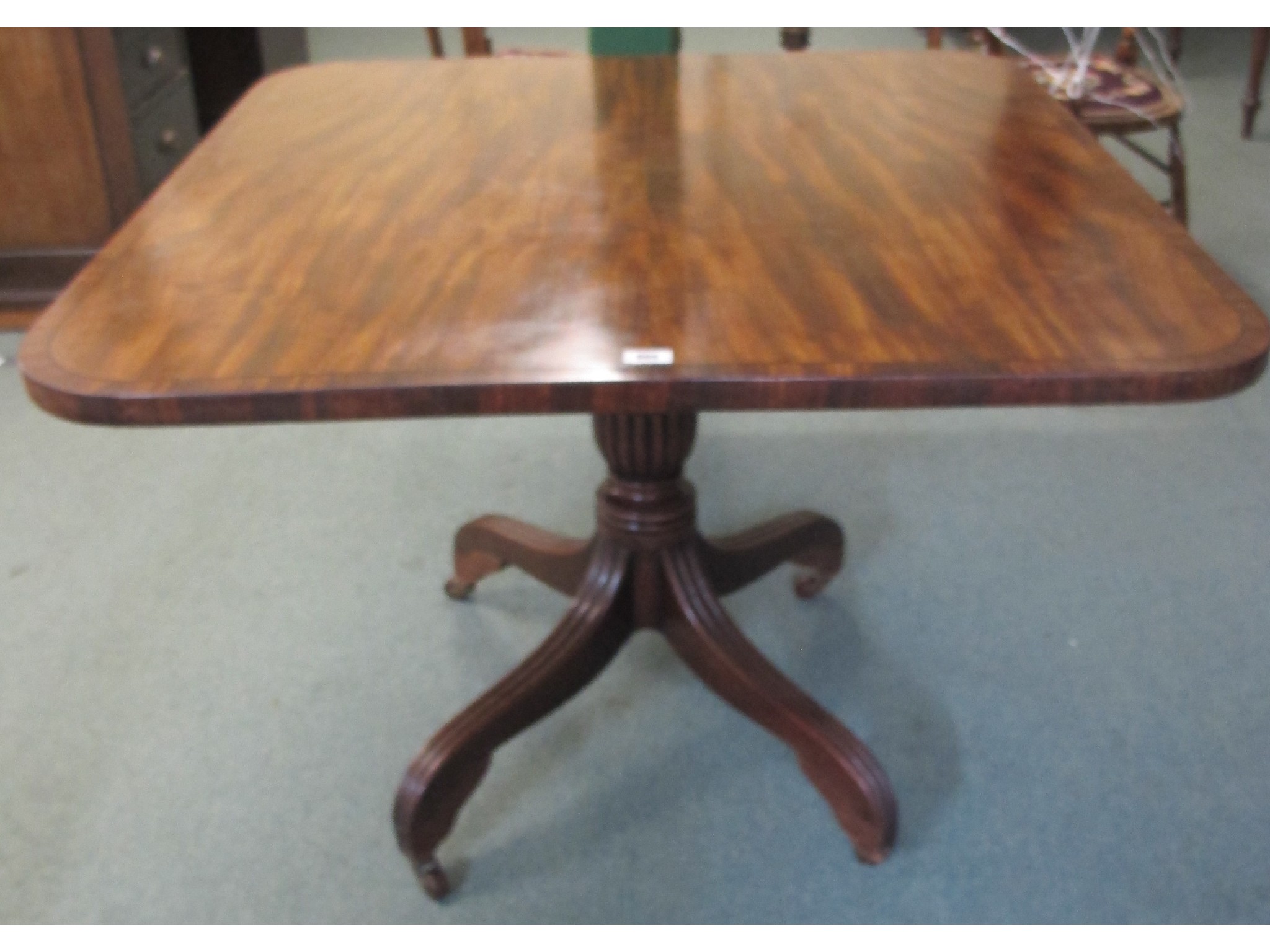 Appraisal: A George IV mahogany snap top table