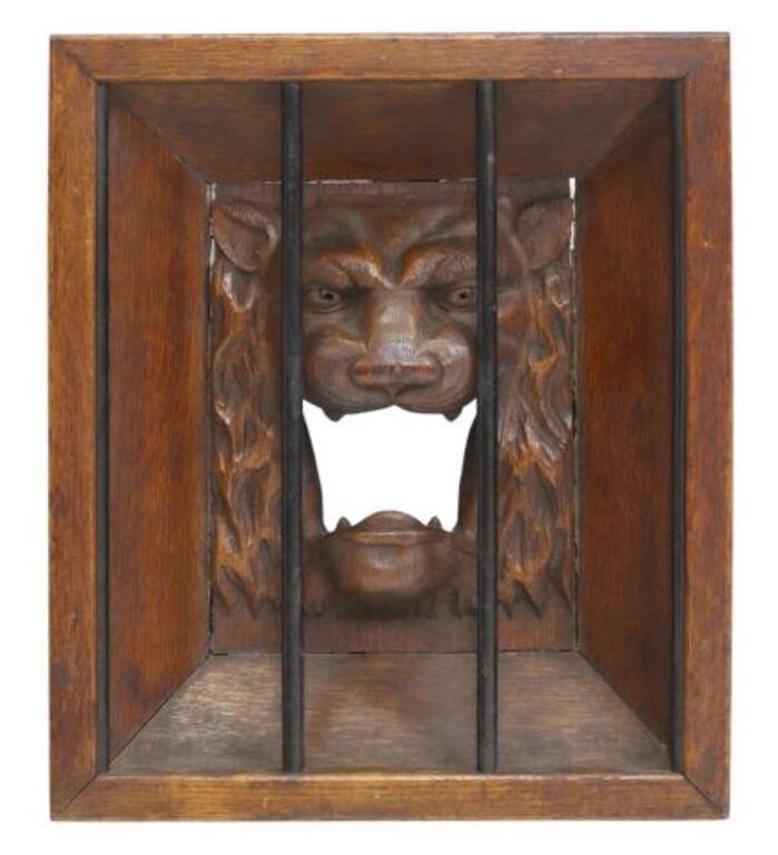 Appraisal: Framed carved oak architectural panel Caged Lion roaring lion behind