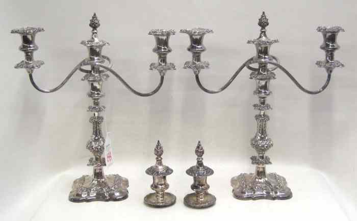 Appraisal: PAIR SILVERPLATED CANDELABRA CANDLESTICKS pieces The pair of English three