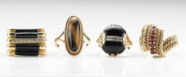 Appraisal: A collection of four black onyx tigers-eye diamond ruby k