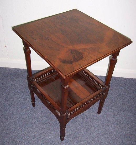 Appraisal: An Edwardian rosewood occasional table the square top on taper