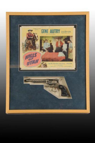 Appraisal: Gene Autry Lobby Card Toy Cap Gun Description Lobby card