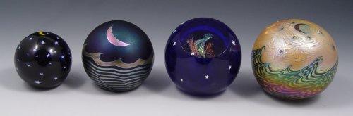 Appraisal: LOT OF FOUR ART GLASS MOON AND STAR PAPERWEIGHTS To