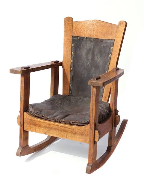 Appraisal: An Arts amp Crafts oak and leather rocking chair height