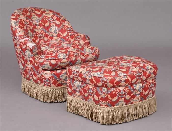 Appraisal: VICTORIAN-STYLE CHINTZ-UPHOLSTERED CLUB CHAIR AND OTTOMAN The chair with barrel