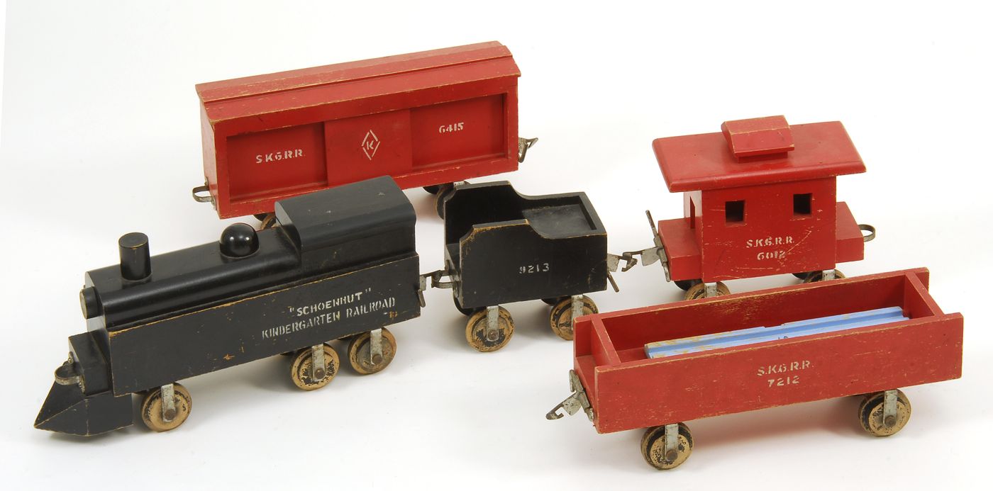 Appraisal: SCHOENHUT PAINTED WOODEN KINDERGARTEN RAILROAD Engine and tender in black