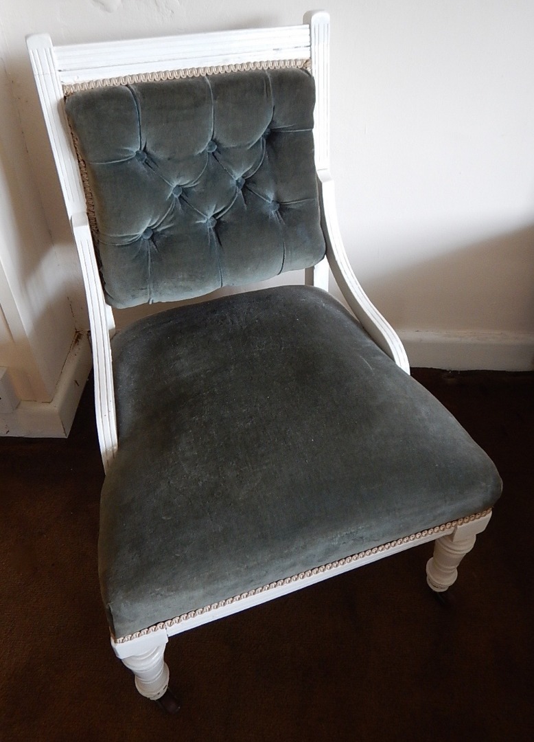 Appraisal: A white painted Victorian low seated nursing chair with buttoned