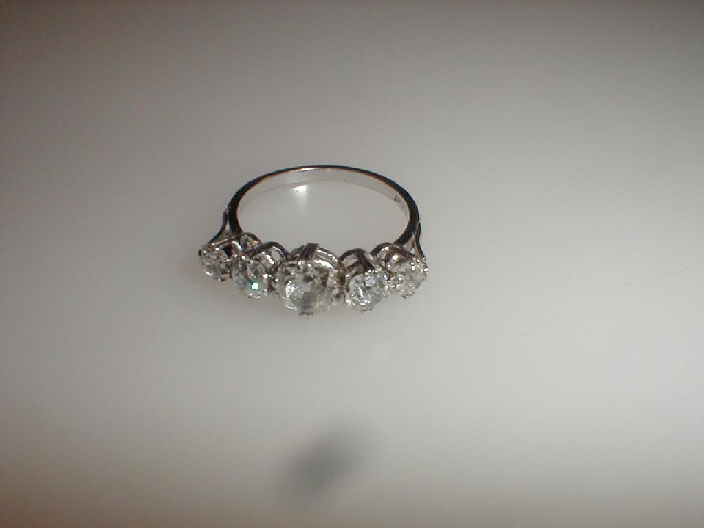 Appraisal: A five stone diamond ring the central old cut cushion