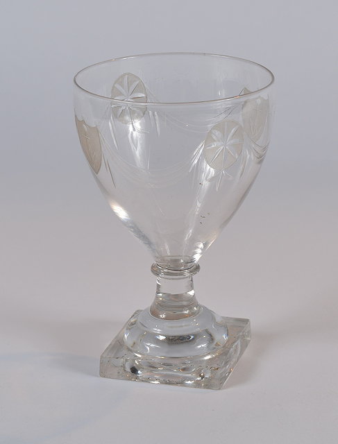 Appraisal: A glass naval rummercirca with swag and shield design on