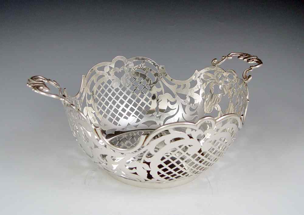 Appraisal: FLORENTINA SILVER RETICULATED BASKET Pierced openwork design marked under one