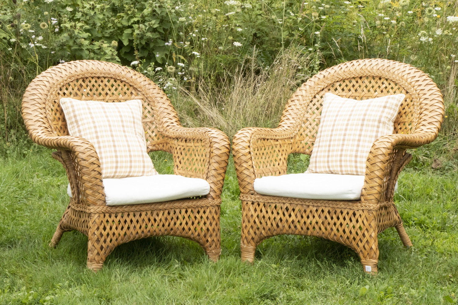 Appraisal: PR RATTAN ARMCHAIRS Pair of Contemporary Woven Rattan Chairs with